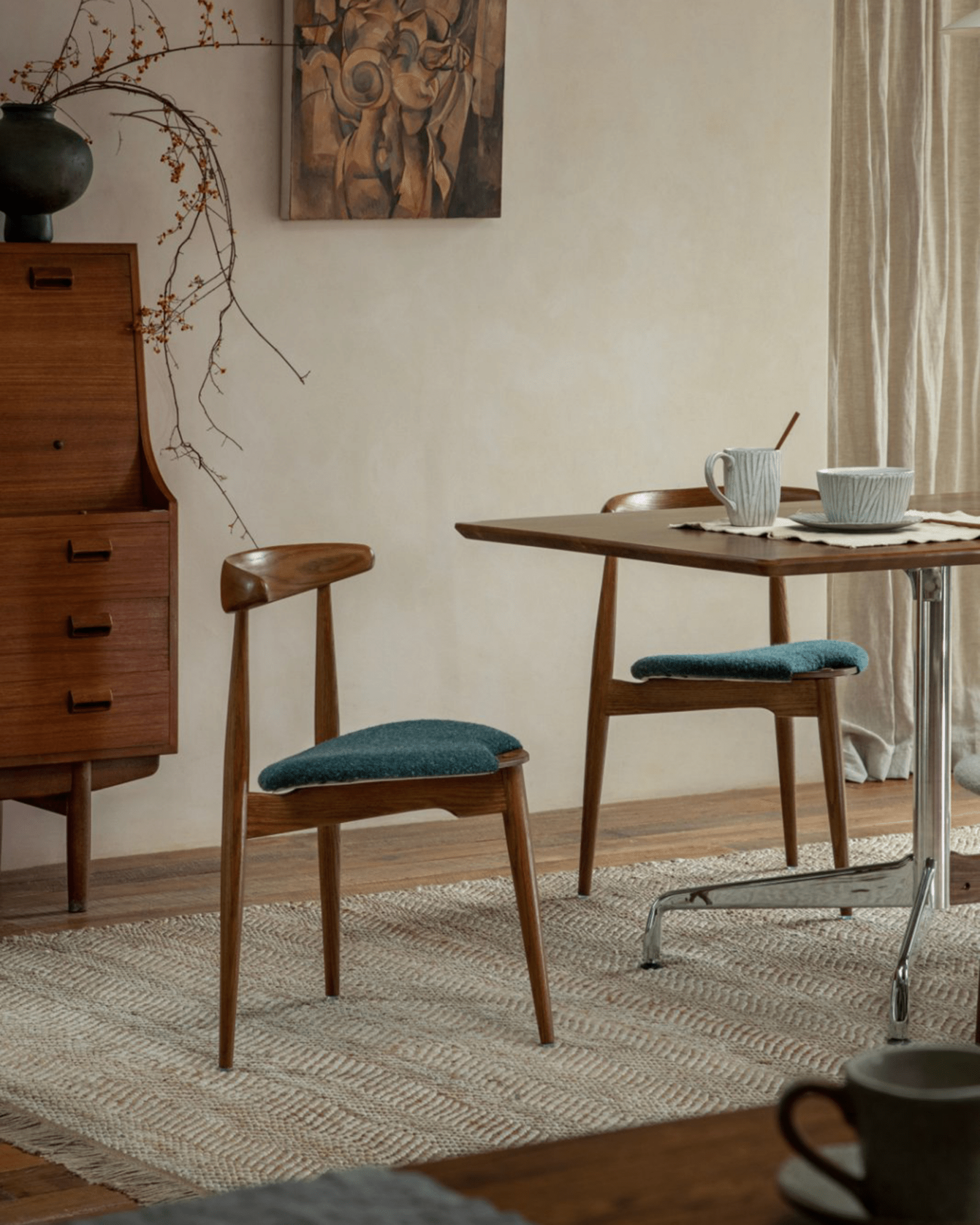 Heart Dining Chair in a dining room setting, showcasing teal seat and oak wood frame with a Danish design.