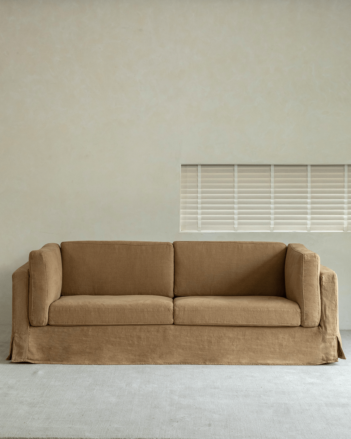 Skirt Linen Sofa in warm brown linen fabric, modern design, breathable and comfortable, perfect for a peaceful living space.