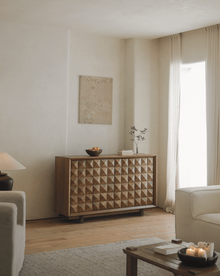 Geometric Bumpy Sideboard with lamp and decorative vase in modern living room.
