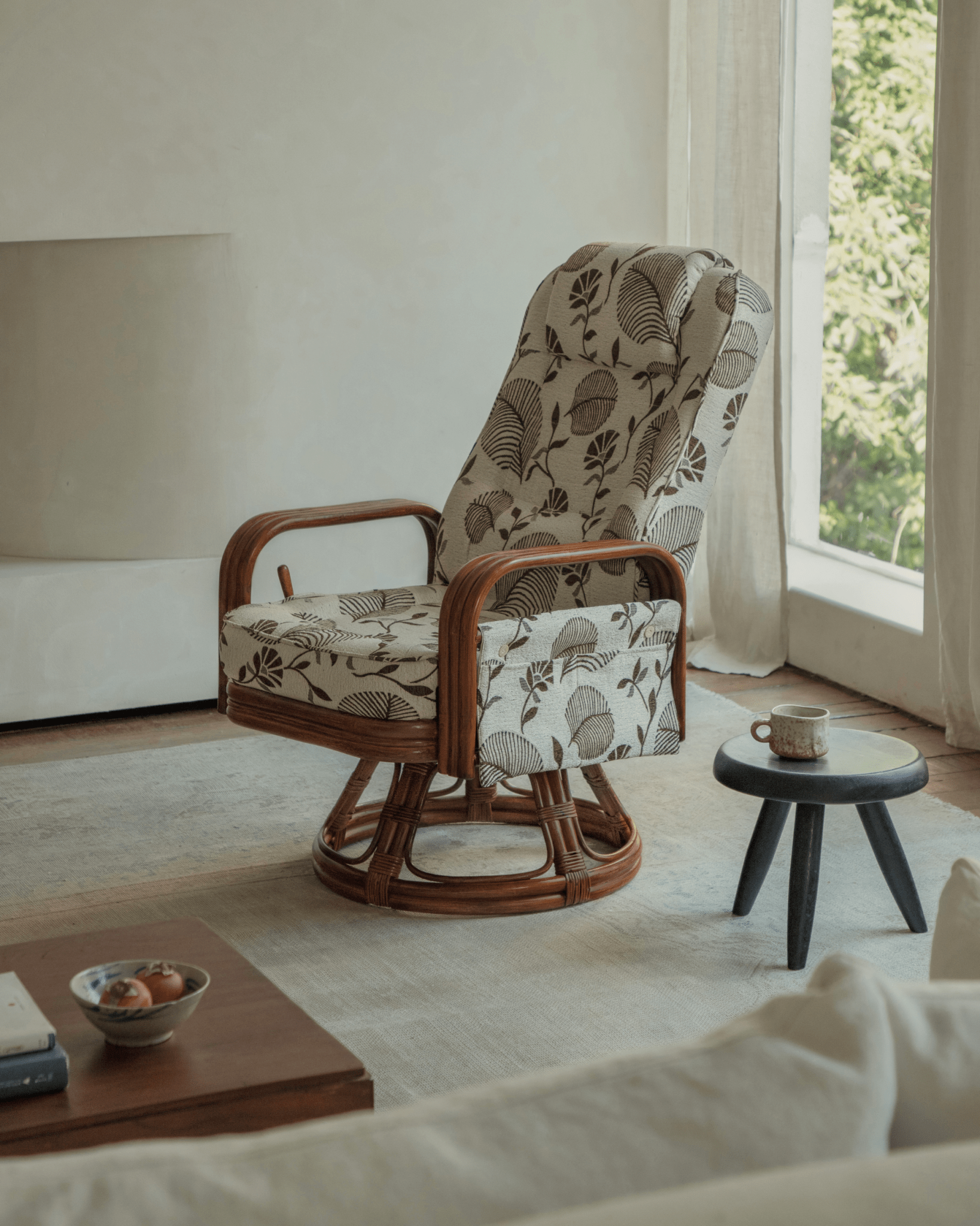Willow Rattan Chair with floral cushion, Indonesian rattan frame, and natural design