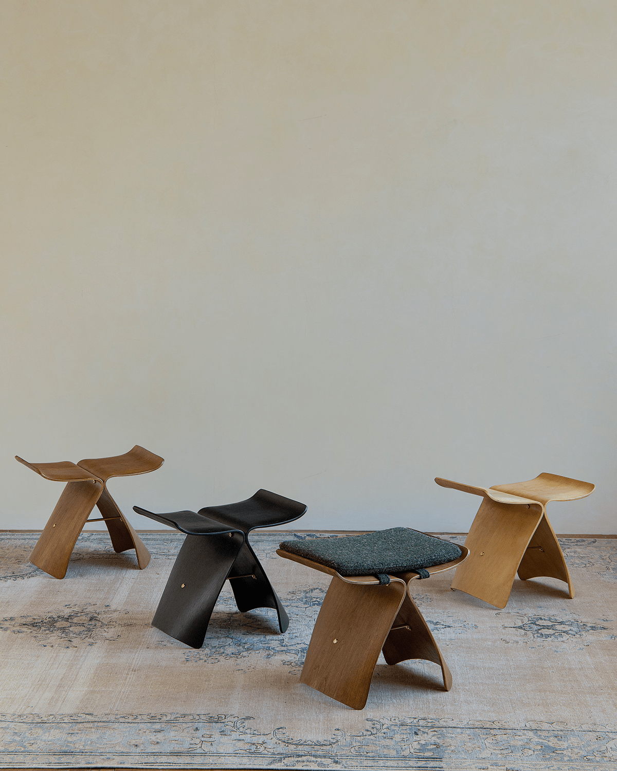 Butterfly Stool in dark wood and black finishes, with fabric cushion options
