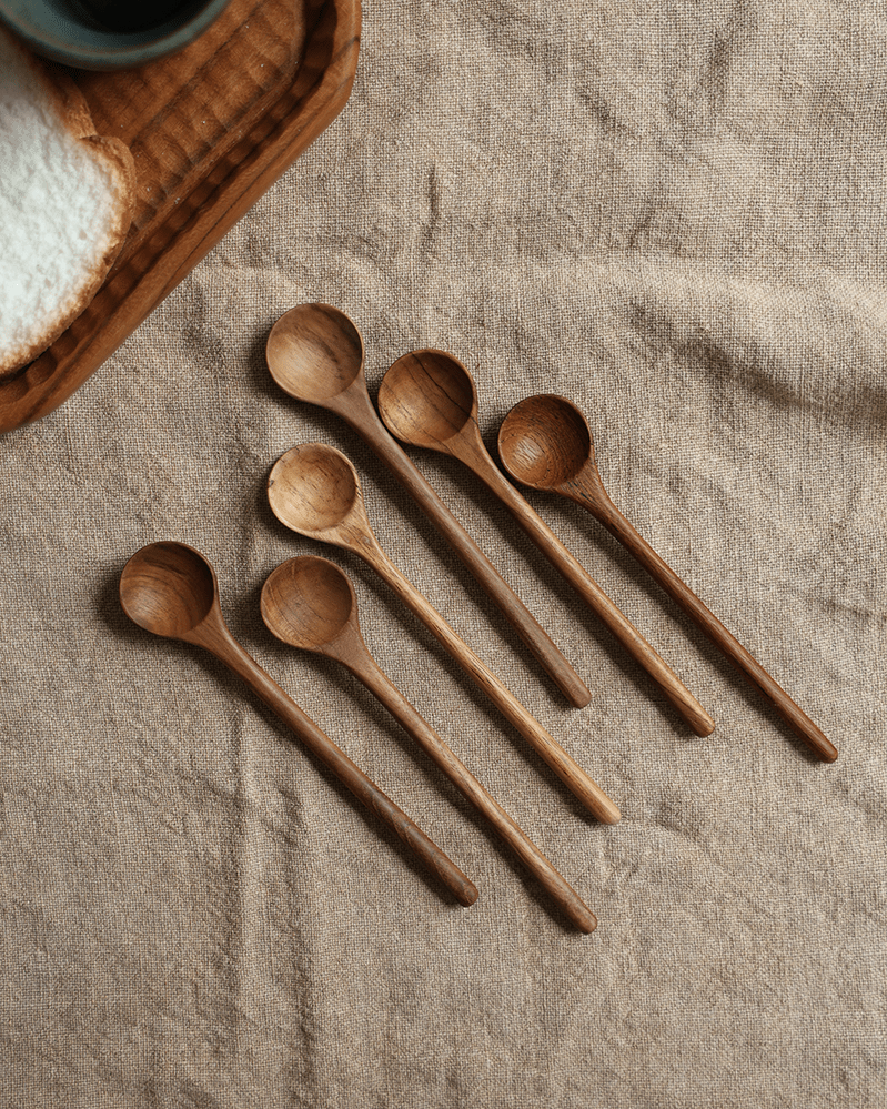 Set of six wooden table spoons on beige linen fabric. Table Spoon*4PCS.