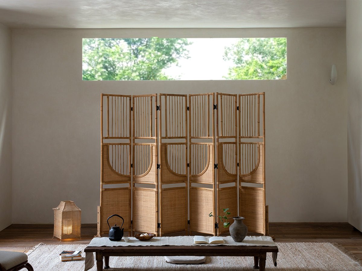 Sunlit Rattan Screen room divider, Indonesian rattan with natural light in minimalist interior.
