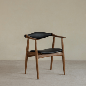 CH34 Yoke Chair in Ebony Wood with black leather upholstery, mid-century modern design.
