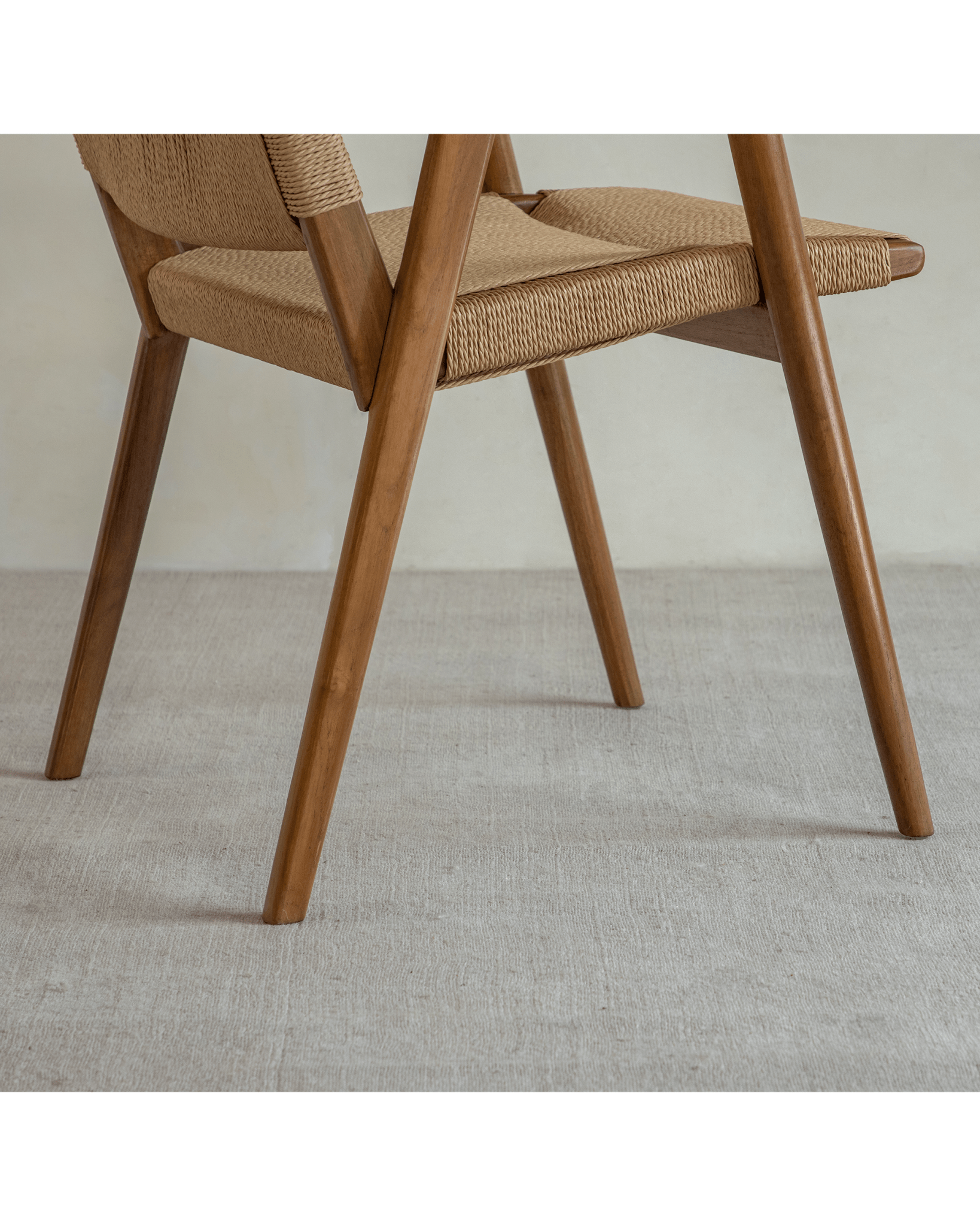 Louisa Chair detail: Teak frame and woven seat, MCM design, perfect for study or dining.