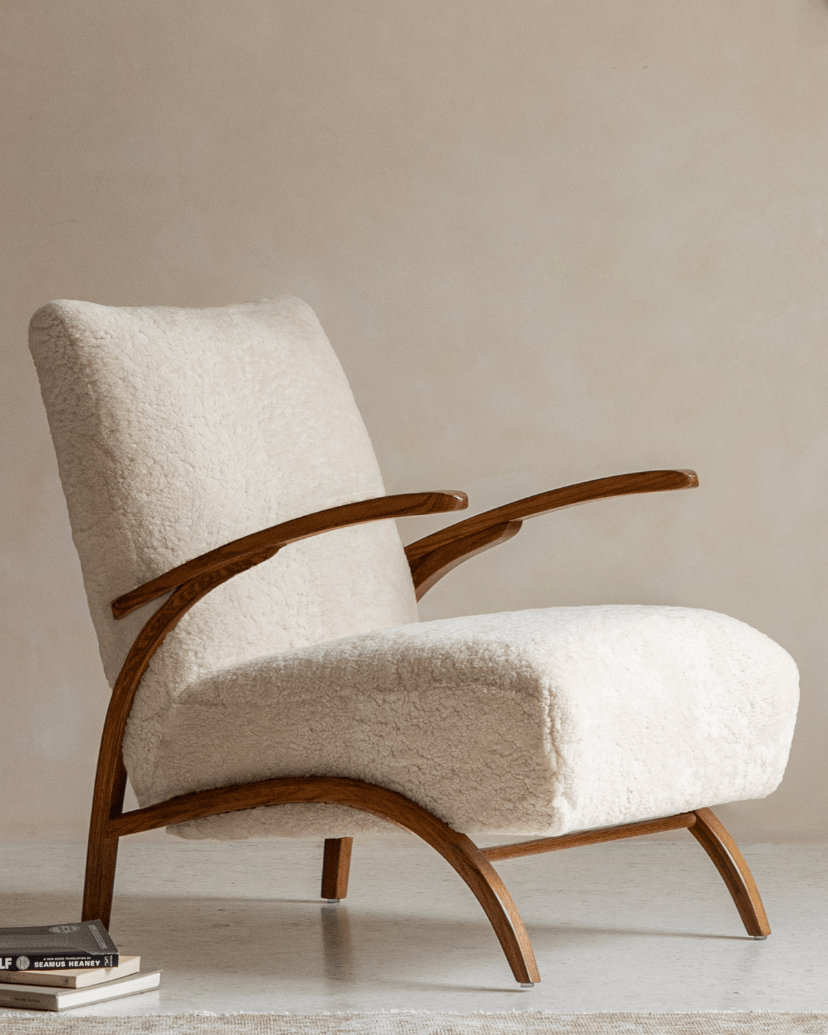 Nebula Lounge Chair in shearling upholstery with red oak frame. Mid-century modern design. Cozy and comfortable.