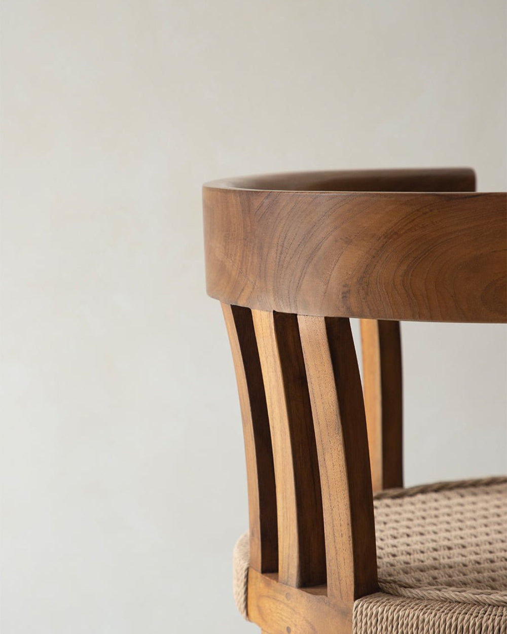 Teak Cord Dining Chair detail: wooden backrest, woven seat, and natural textures
