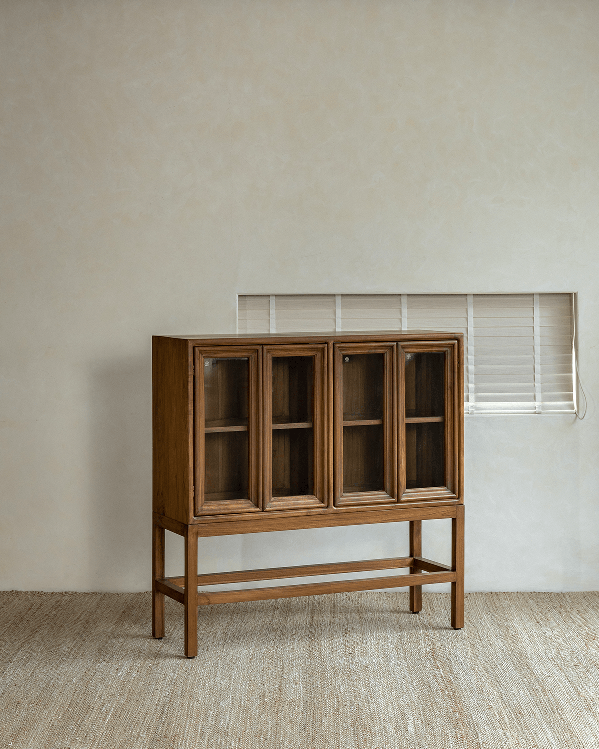 Stilt Cabinet - Teak wood cabinet with glass doors, elegant storage and display solution
