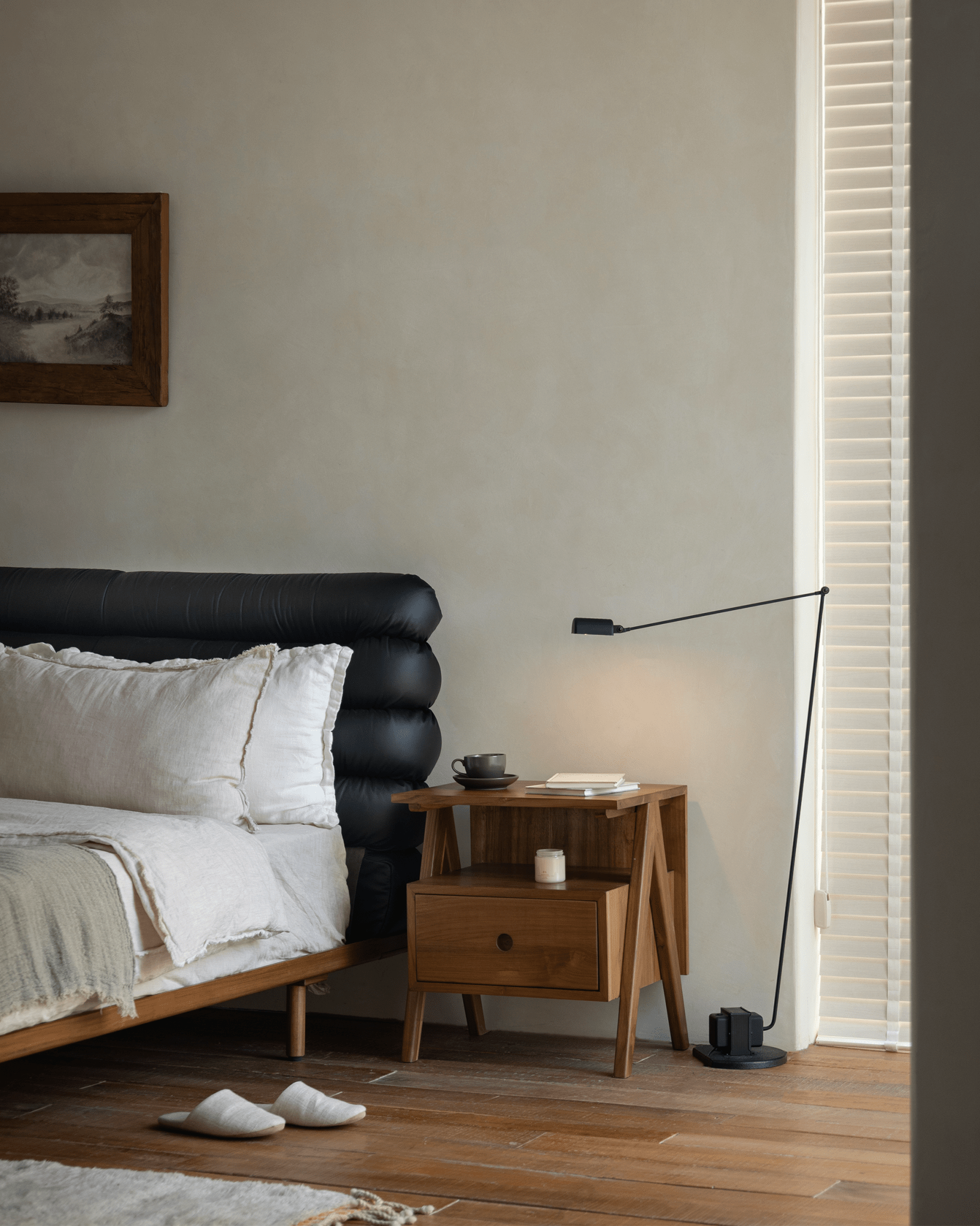 ZM Home Astral Nightstand in bedroom setting with lamp, artwork, and bed. Modern bedroom furniture.