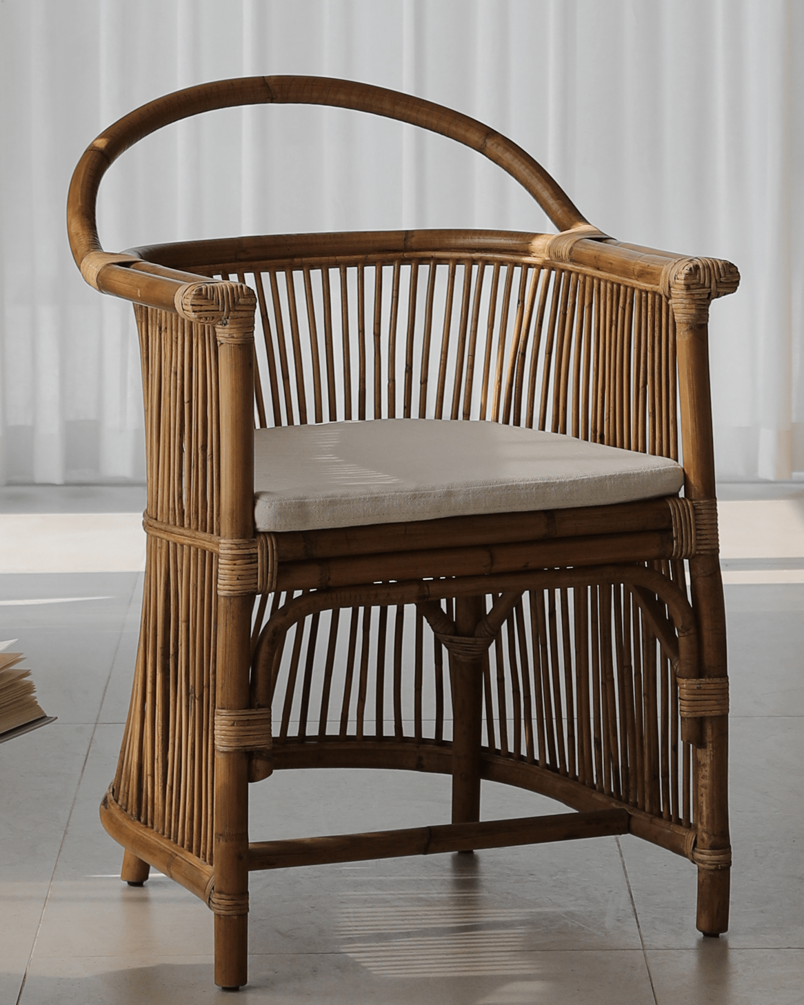 Cape Chair - Natural rattan chair with hanging backrest and linen cushion for ultimate comfort