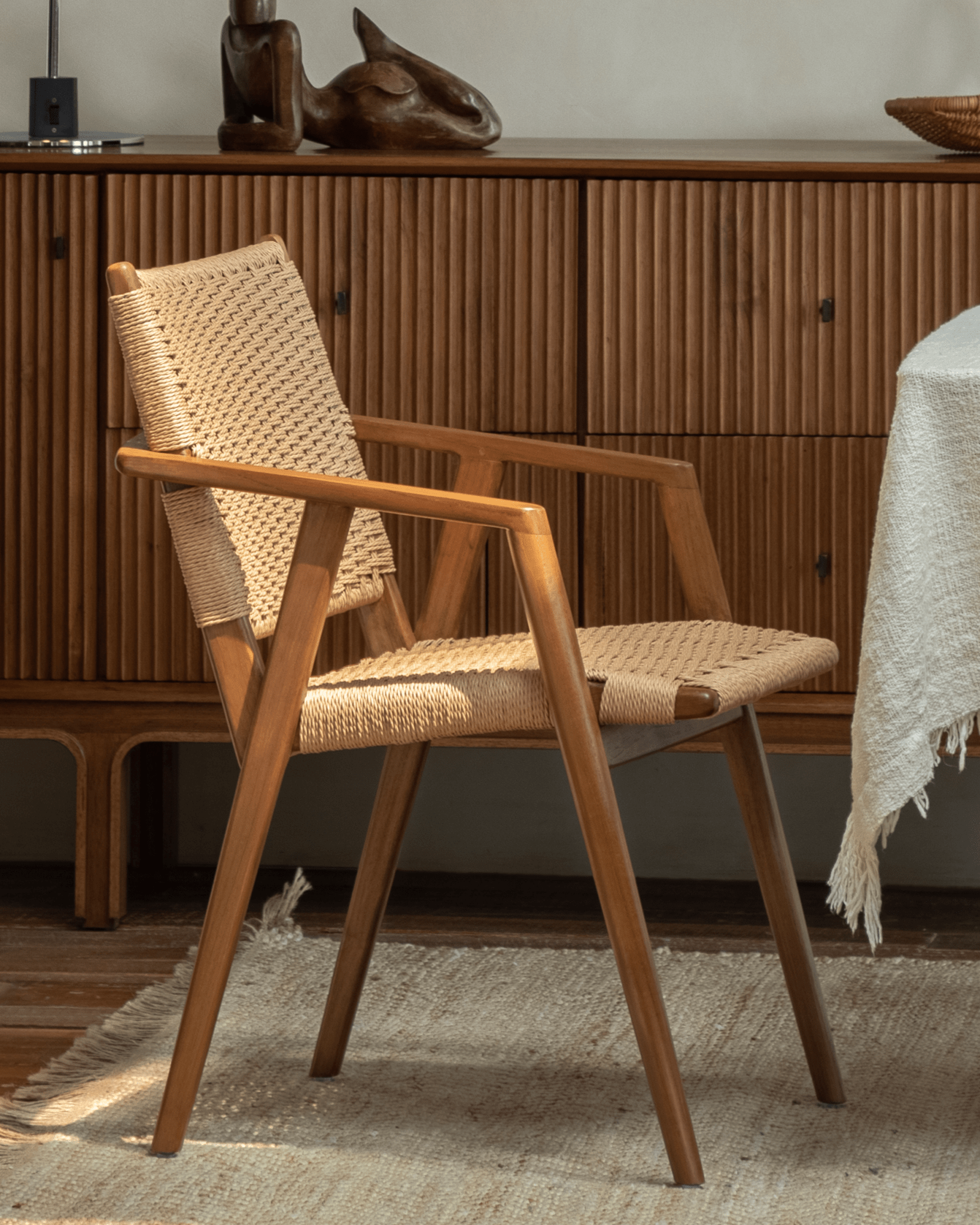 Louisa Chair with teak frame and woven seat, ideal for a study or dining area, demonstrating Mid-Century Modern design.