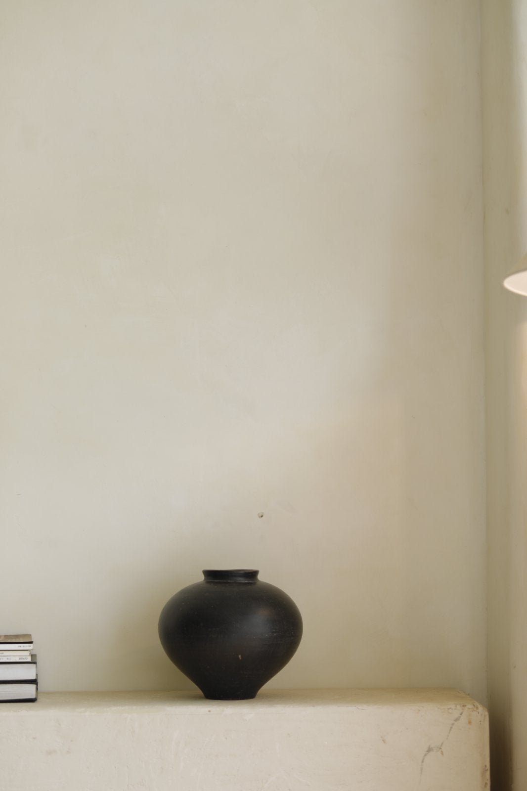 Black ceramic vase, spherical design, minimalist decor, perfect for home decor
