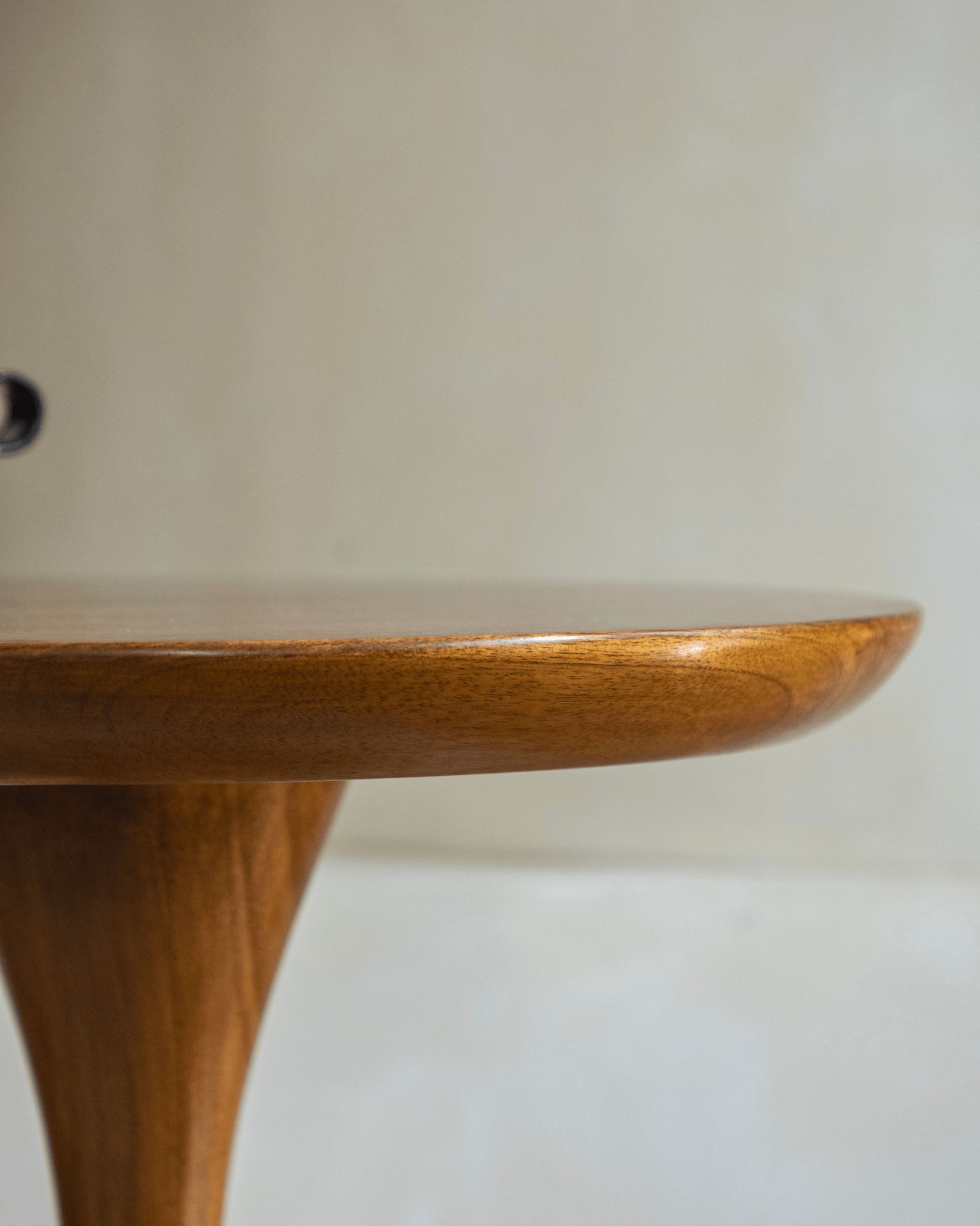 Solid teak Spindle Side Table, close-up of rounded tabletop edge and hourglass base design
