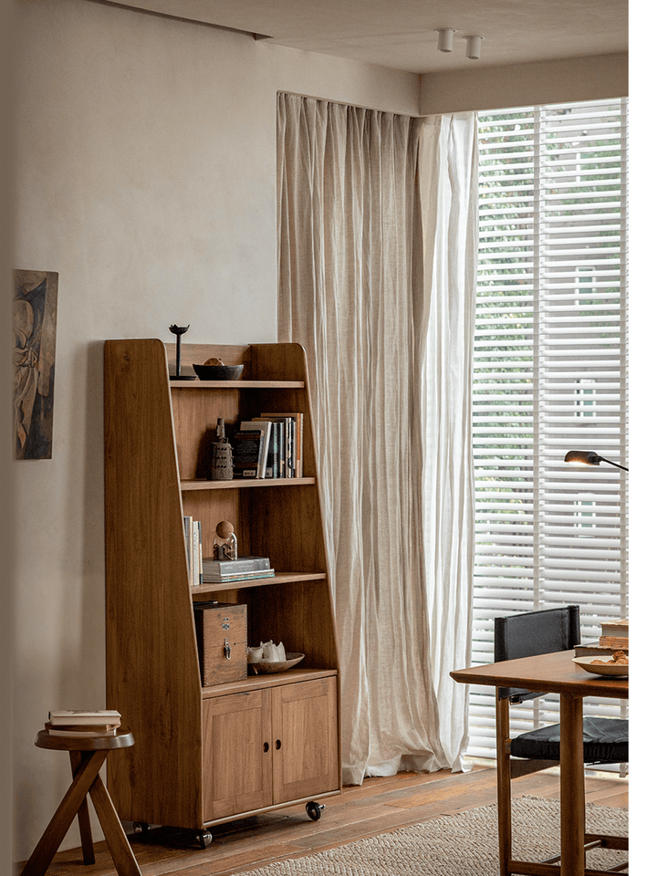 Modern teak wood display cabinet with open and closed storage in stylish interior.