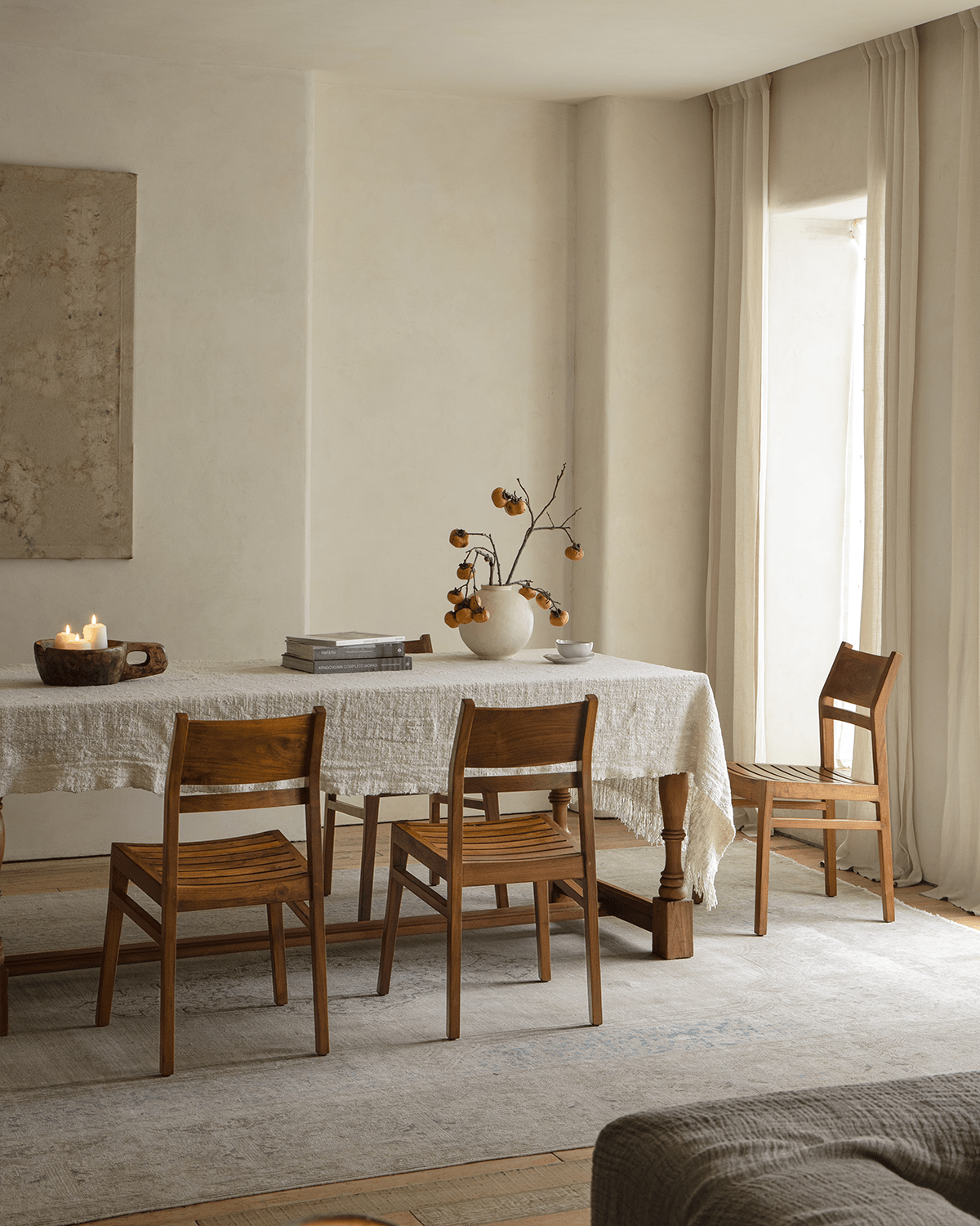 Beam Chair with teak wood frame in dining room, showcasing design, material and space-saving style for elegant comfort.