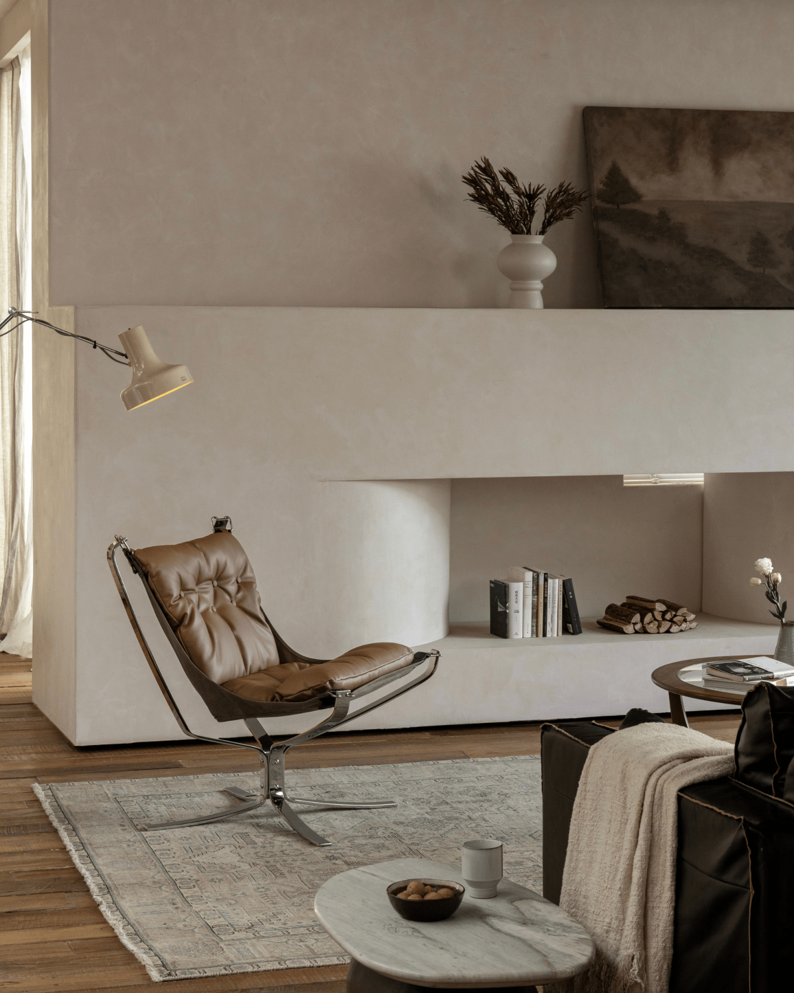 Falcon Chair in brown leather with stainless steel frame, Scandinavian interior design, premium comfort, modern living room