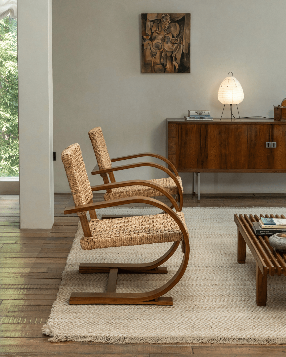 Mid-century modern C Curve Lounge Chairs in cozy living room setting, bentwood frame and woven grass rope seat
