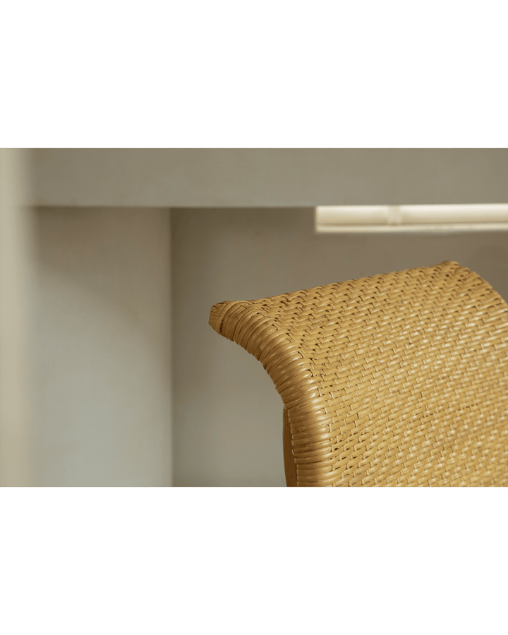 Close-up of handwoven Nalgae rattan lounge chair highlighting natural texture and design.