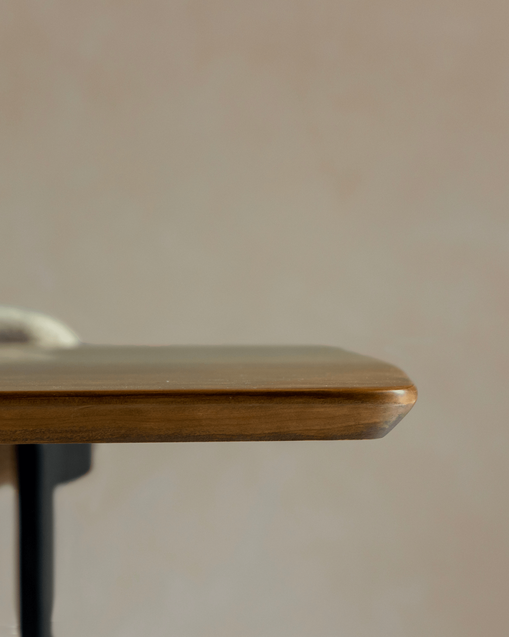 Eames Long Table detail: Burmese teak veneer top with rounded edge, mid-century design