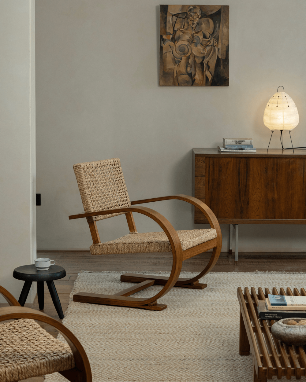C Curve Lounge Chair in mid-century modern living room, featuring bentwood frame and woven grass rope seat
