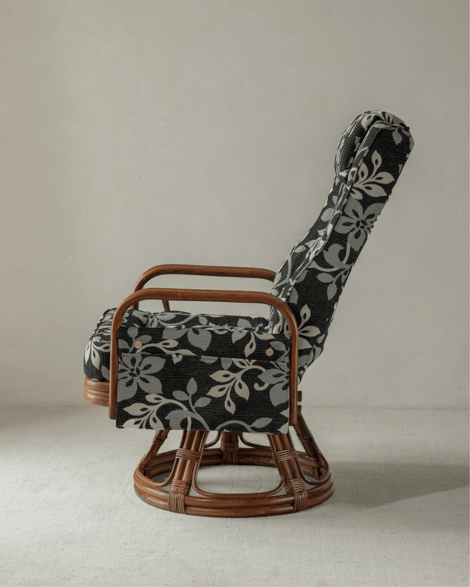 Willow Rattan Chair with floral cushions, rattan frame, and modern design