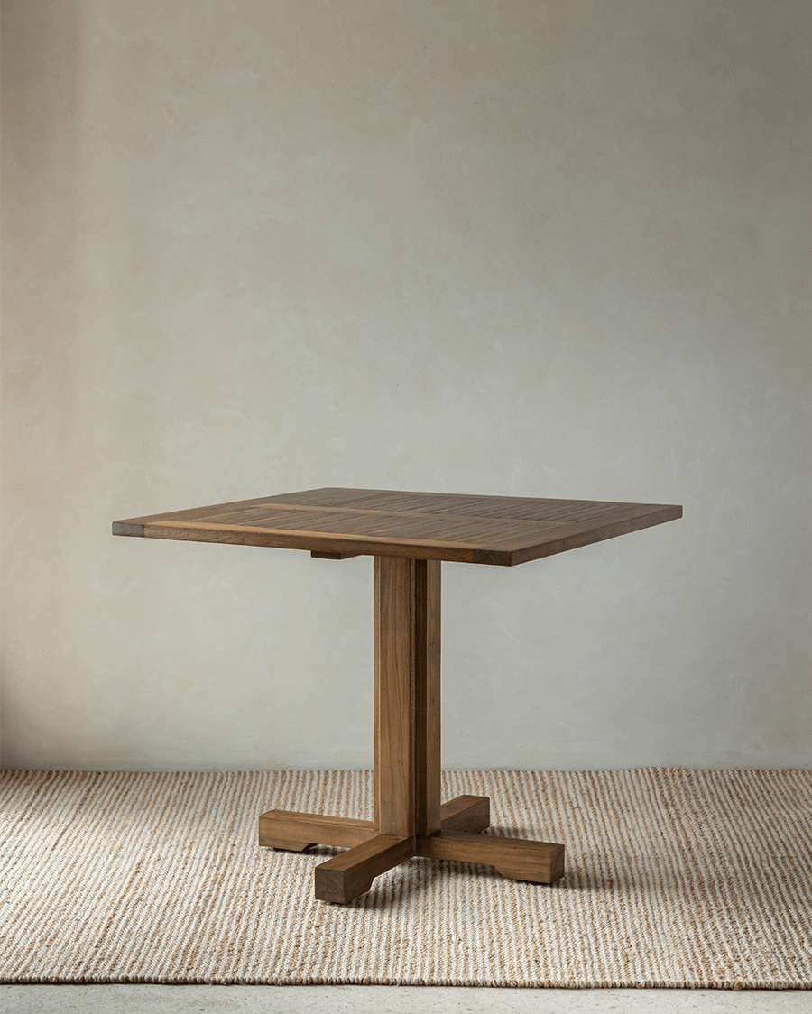 Felix Square Teak Table. Durable design perfect for dining. Indonesian teak wood table with a sturdy column leg.