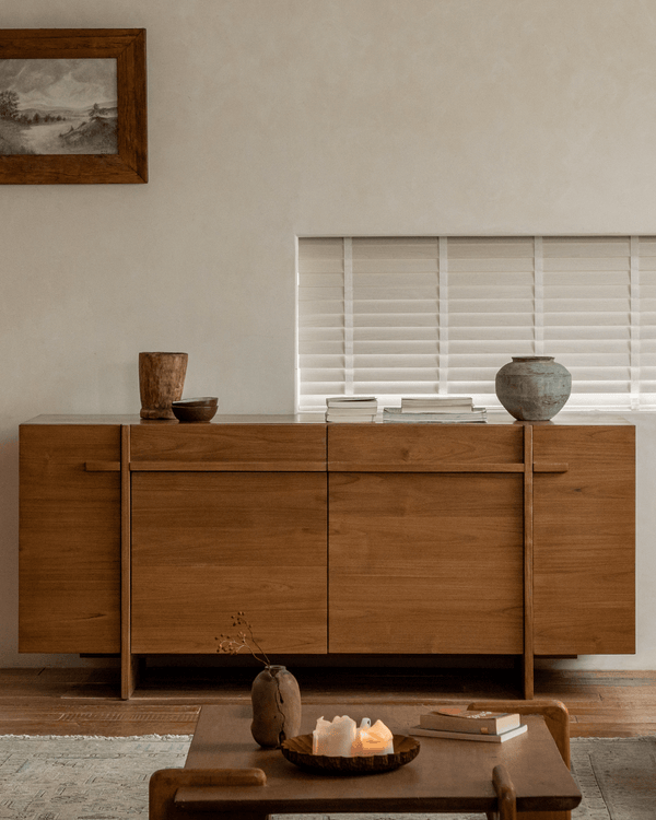 NO.42 sideboard in solid teak with decorative pottery and books on top