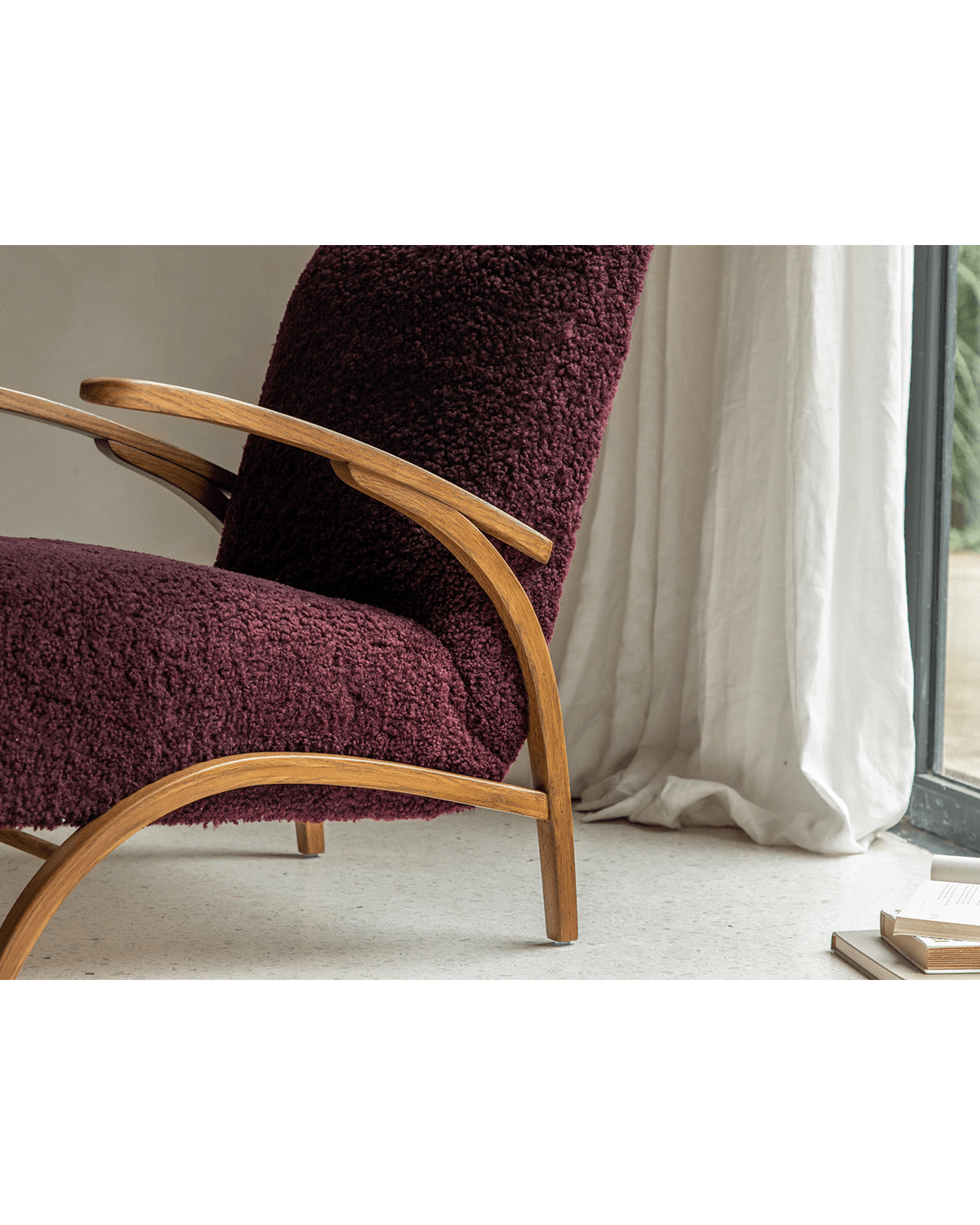Nebula Lounge Chair with burgundy shearling upholstery and red oak frame, mid-century modern design