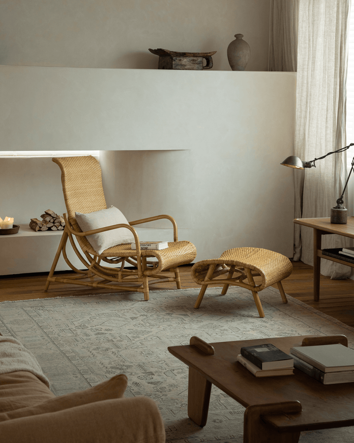 Nalgae rattan lounge chair and ottoman in a cozy, minimalist living room
