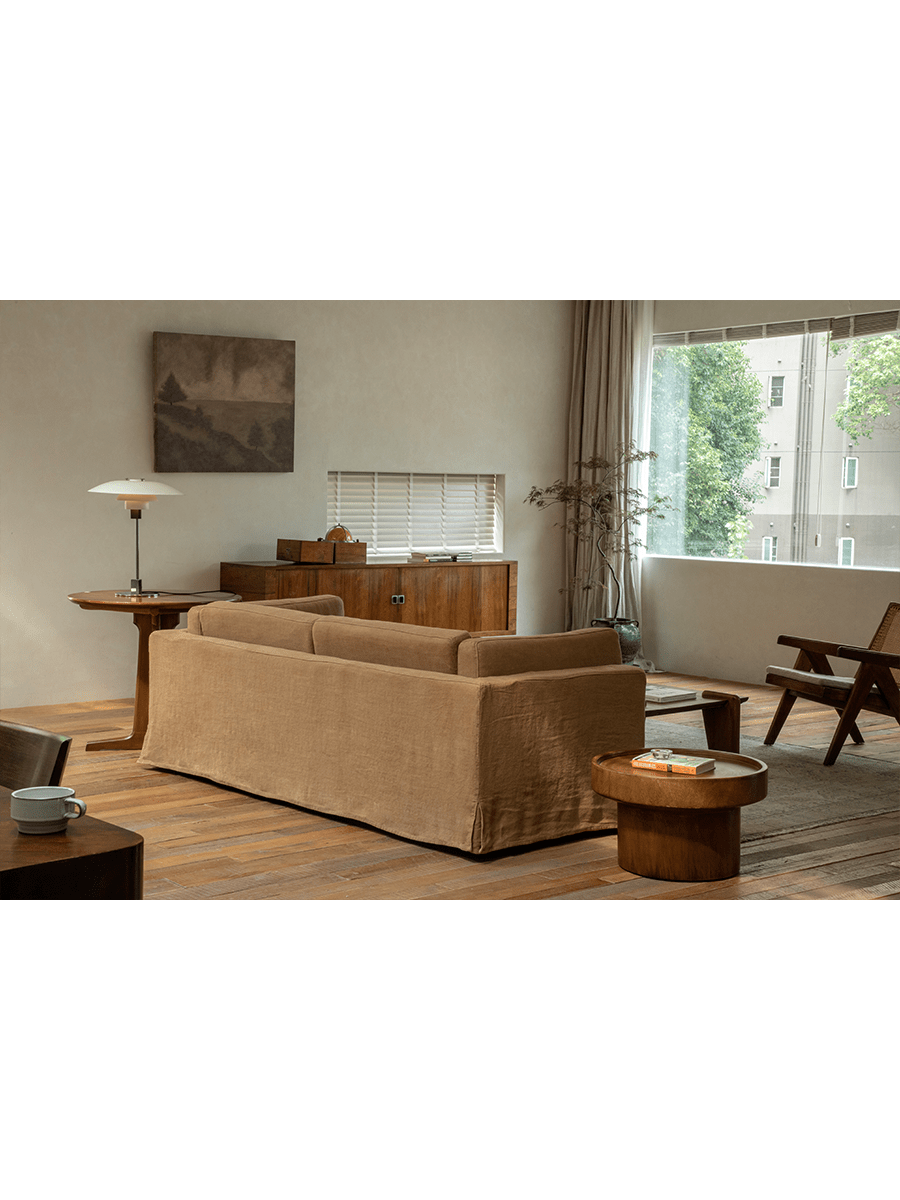 Brown Skirt Linen Sofa in modern living room setting, linen fabric, wooden details, creating a peaceful atmosphere