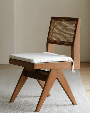 Chandigarh armless office chair with teak wood frame, rattan backrest, and white linen cushion