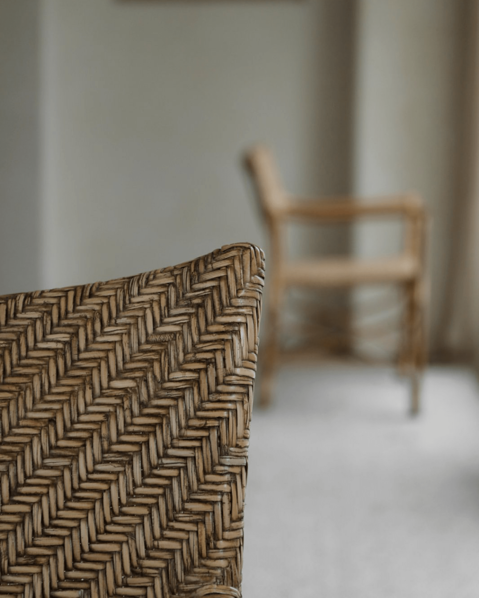 Dingee Chair detail: Woven back, natural wood frame, showcasing craftsmanship.