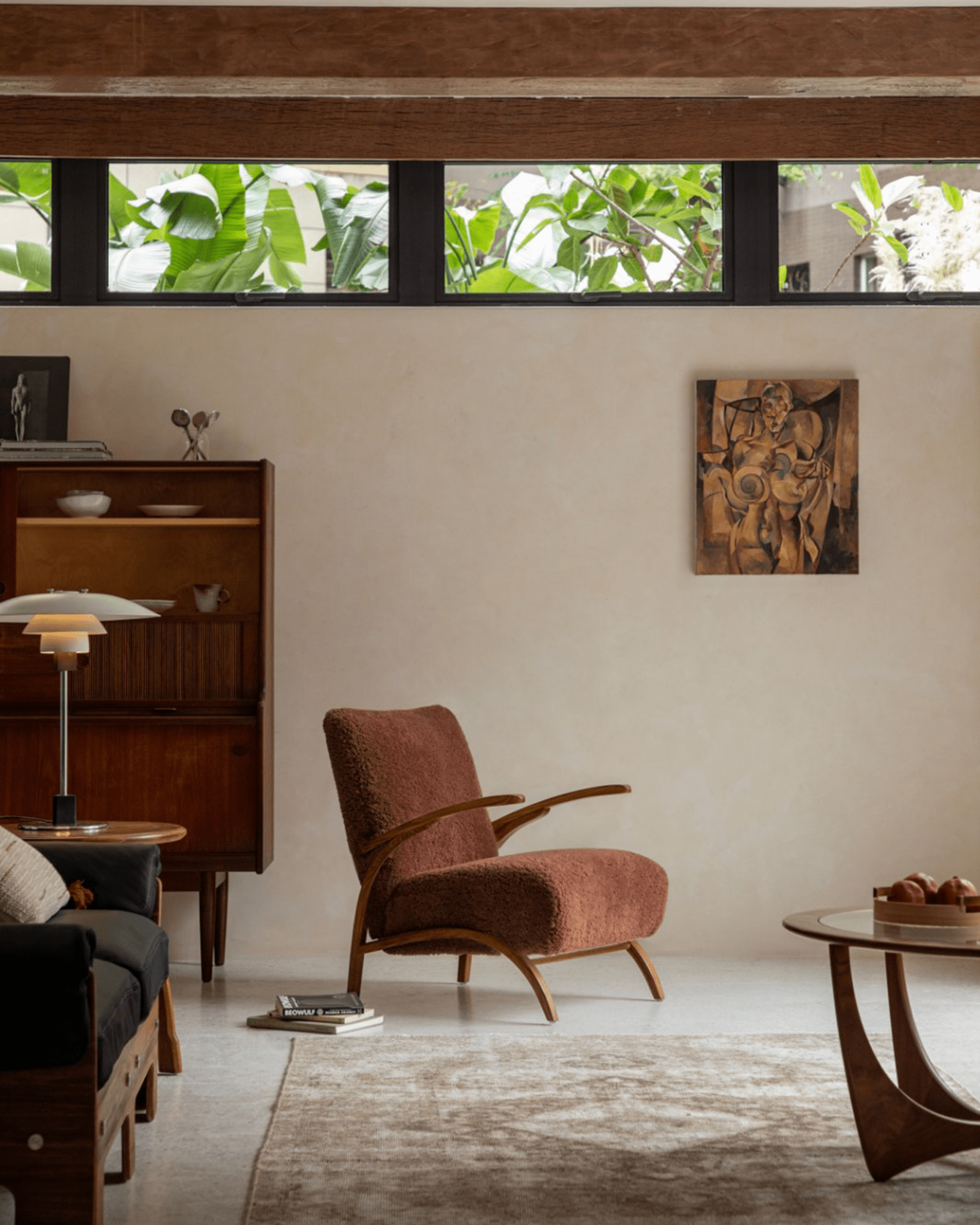 Nebula Lounge Chair in a cozy living room, burgundy shearling upholstery and red oak frame, mid-century modern design
