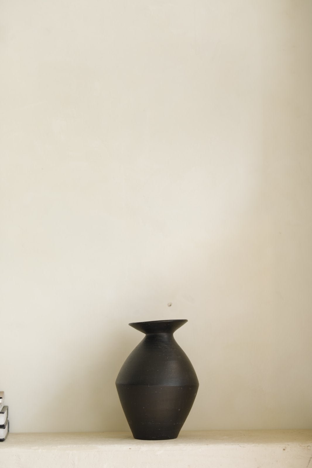 Black ceramic vase for home decor, modern and minimalist design
