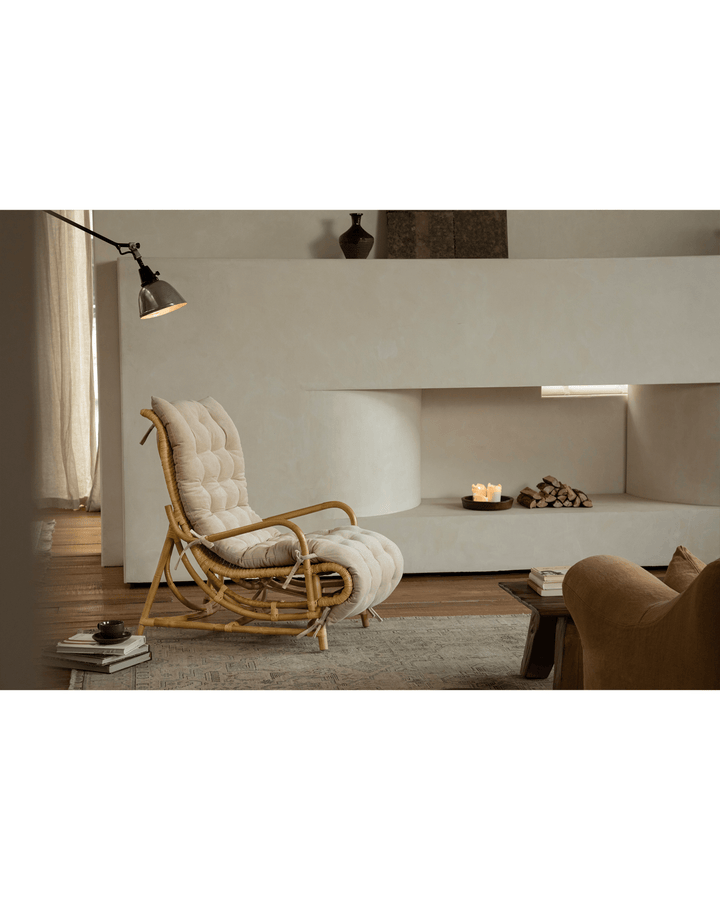 Nalgae rattan lounge chair with soft cushion in a cozy minimalist living room