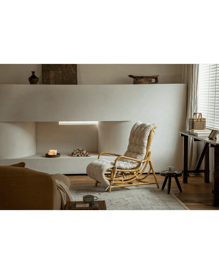Nalgae rattan lounge chair with soft cushion and ottoman in a cozy living room