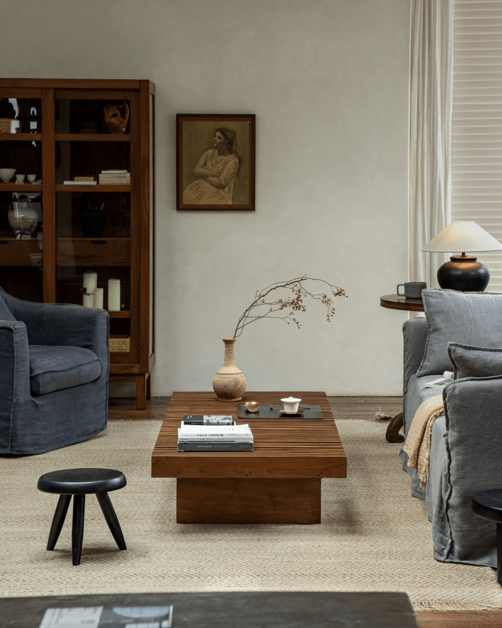 Riva Coffee Table in modern organic living room, solid teak wood slatted design, mid-century modern style.