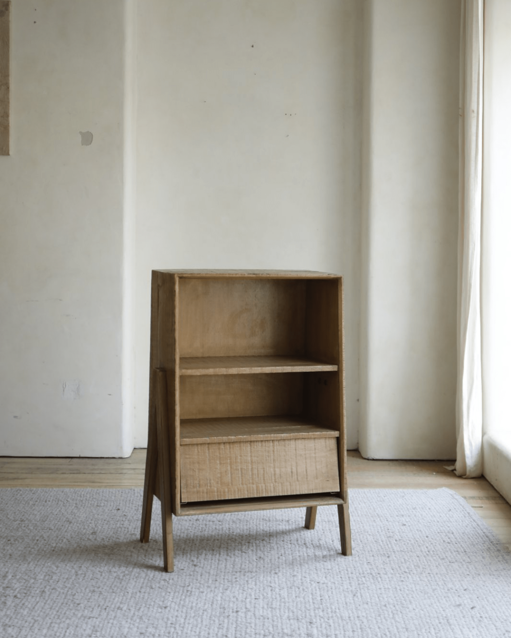 Kin Display Cabinet in rustic wood design, featuring open shelving and drawer storage, ideal for versatile display.