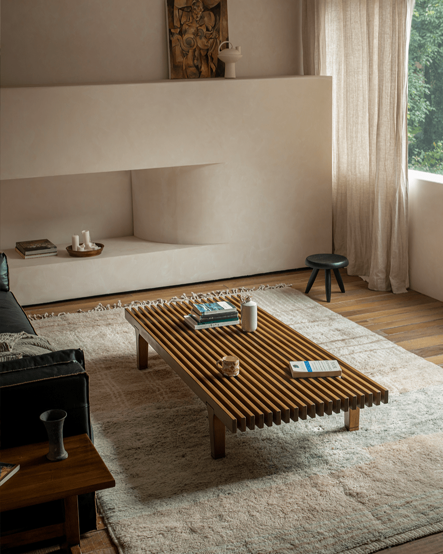 ZM Daybed Coffee Table in modern living room setting. Teak wood with slatted design, minimalist style.