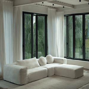 Doma Sectional Sofa in White Linen. Wide armrests for comfort in a bright, airy living space with modular design.