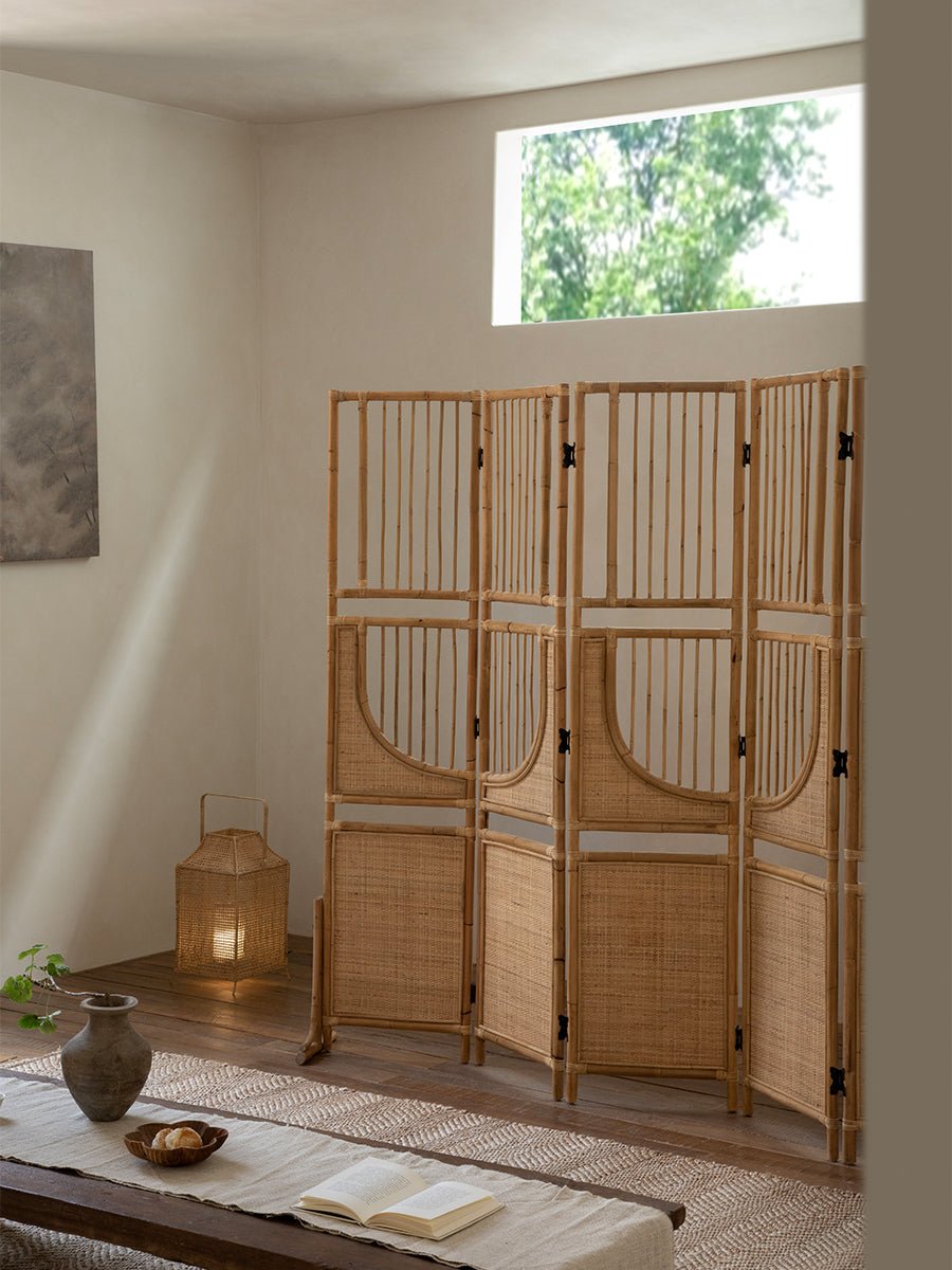 Sunlit four-panel Indonesian rattan screen room divider, perfect for versatile space division and minimalist interior design.