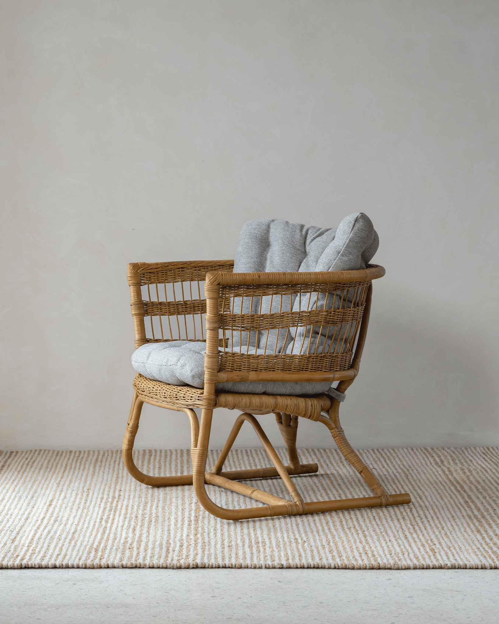 Helian Rattan Chair - natural rattan frame with a fluffy silk cushion for ultimate comfort and style