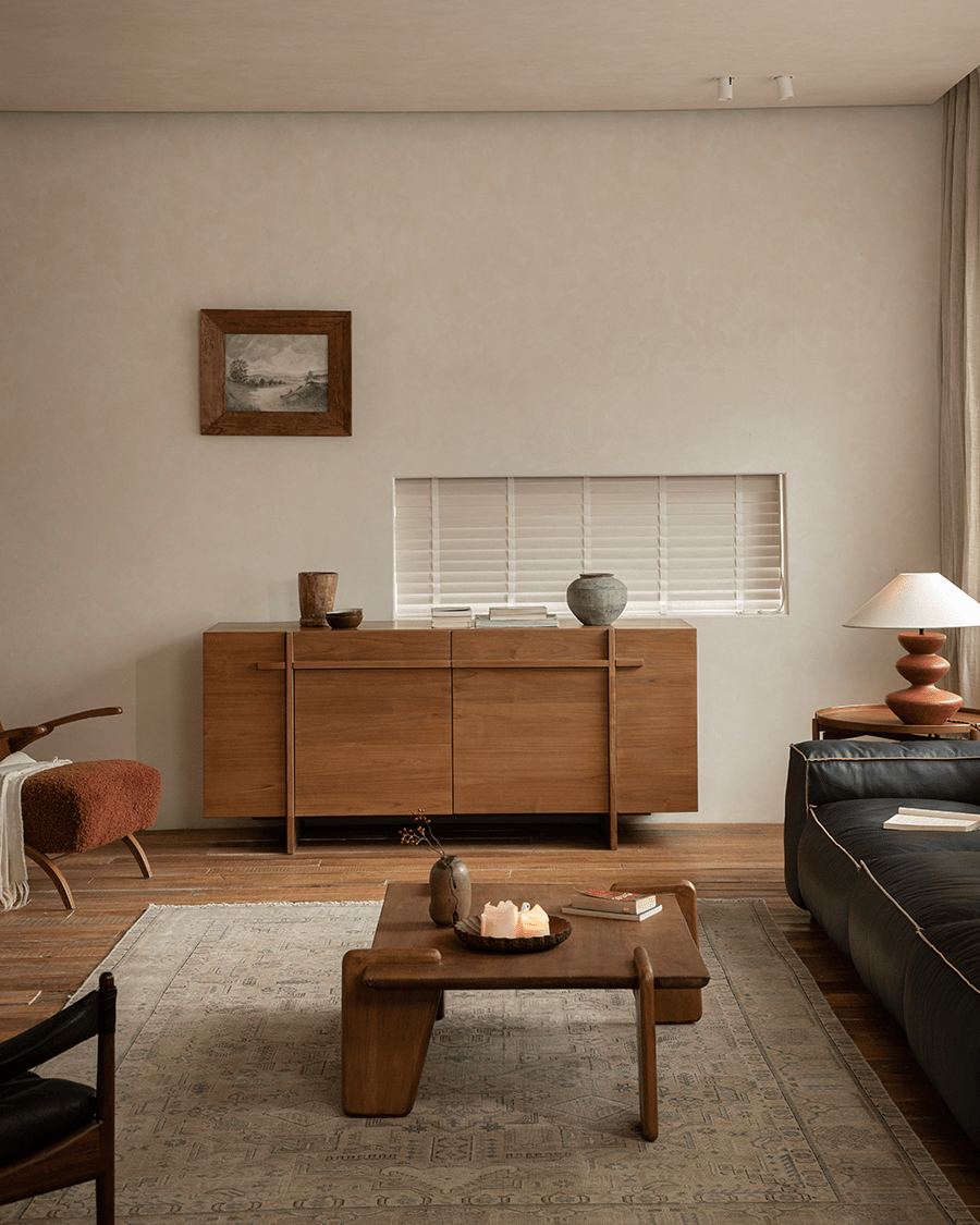 NO.42 Teak Sideboard in a furnished living room setting, showcasing natural teak wood and ample storage.