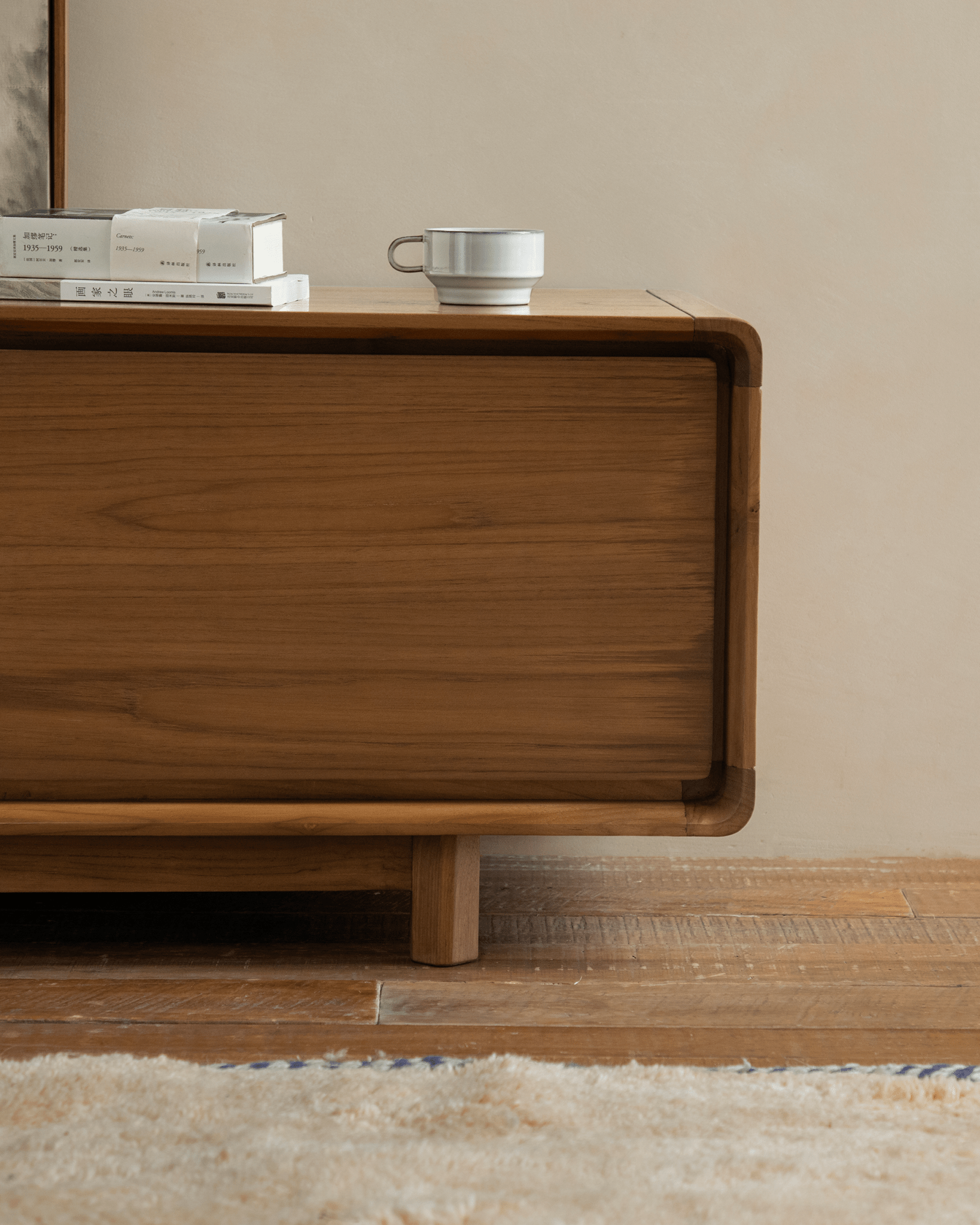 NO.34 Media Console wooden cabinet with books, coffee cup, and texture details