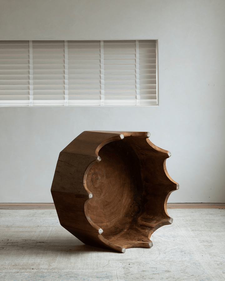 Decagon Side Table on textured surface in modern interior.