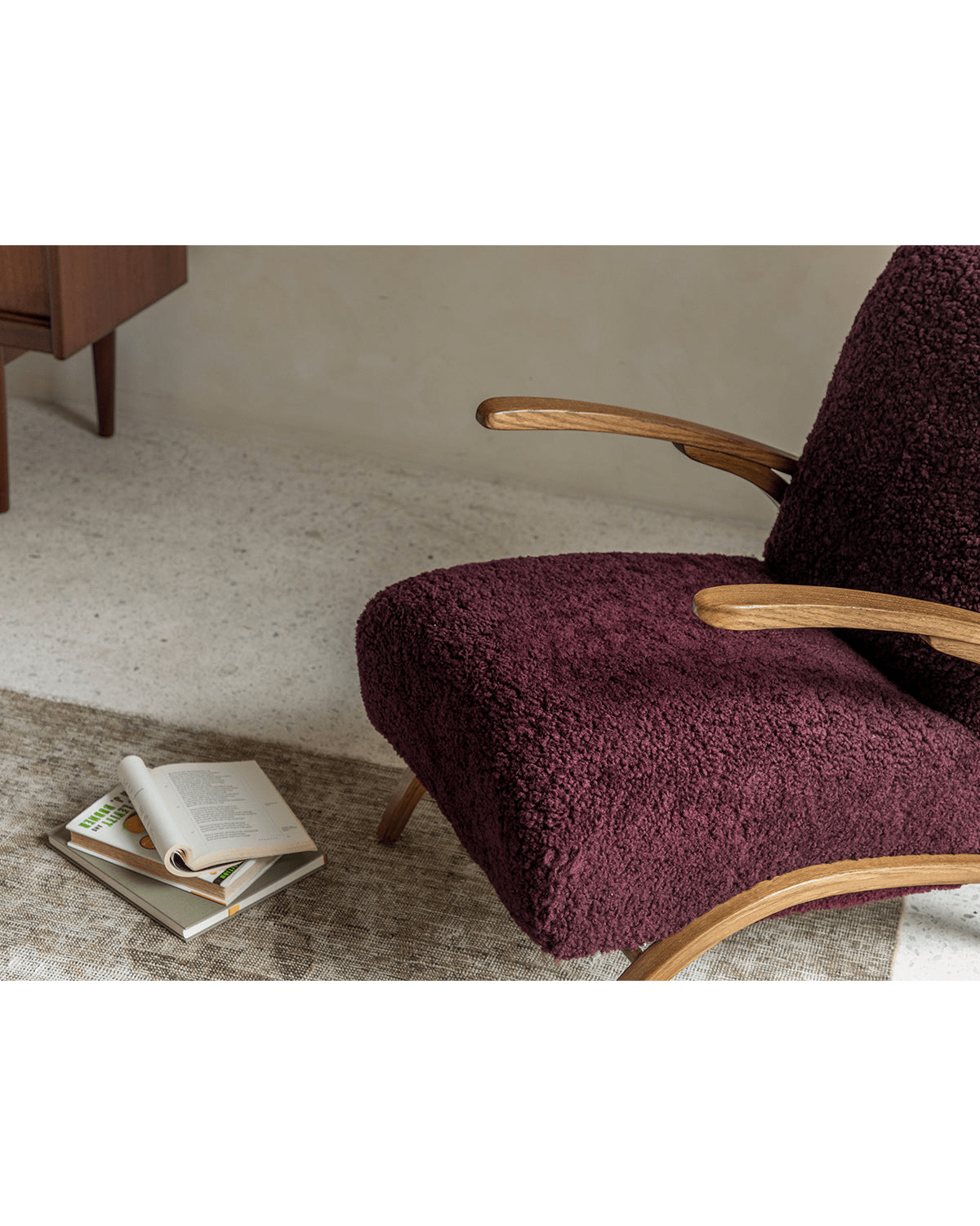 Nebula Lounge Chair in burgundy shearling upholstery with red oak arms, mid-century modern design.