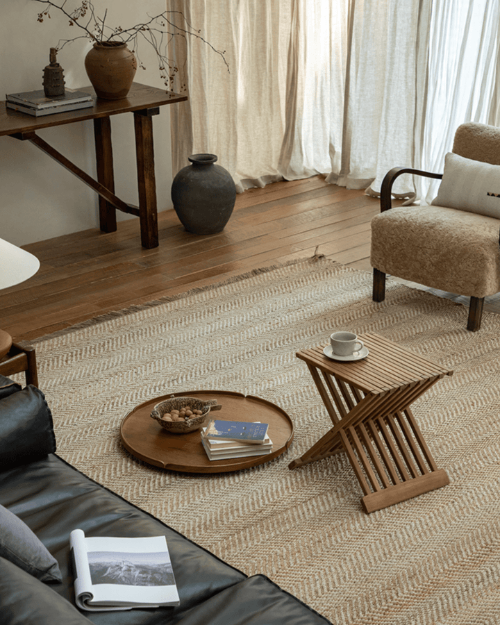 Cozy living room featuring a folding coffee table and natural decor elements
