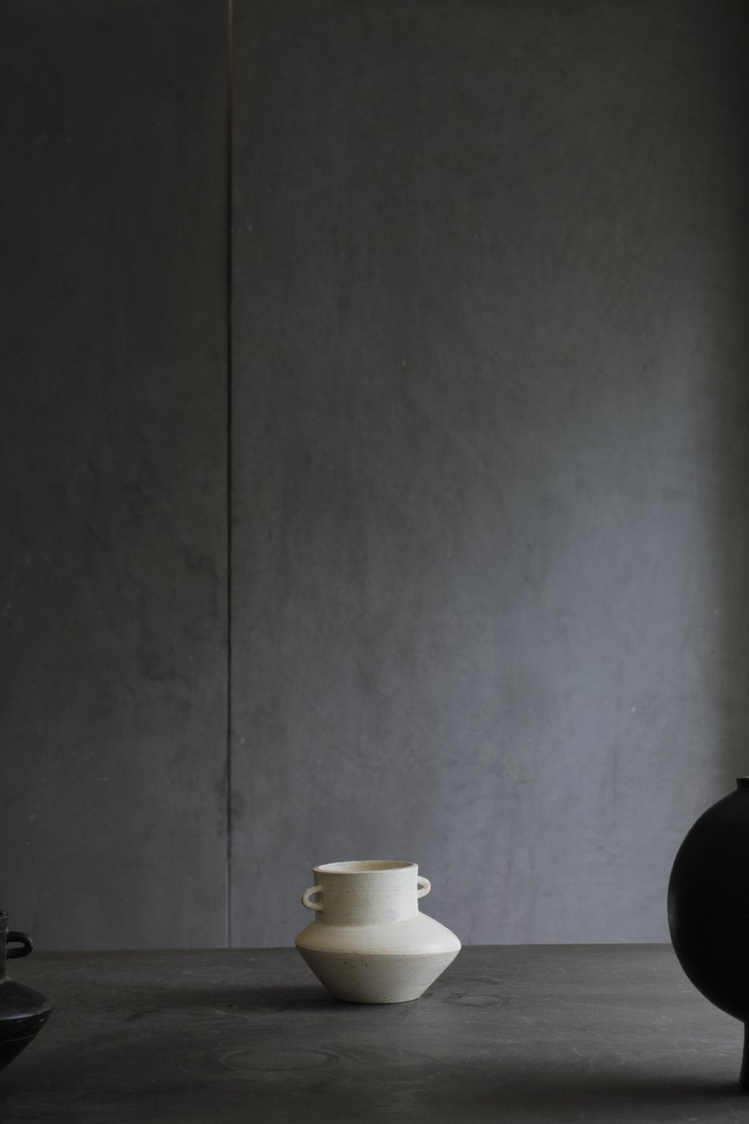 Off-white ceramic vase with handles, minimalist home decor