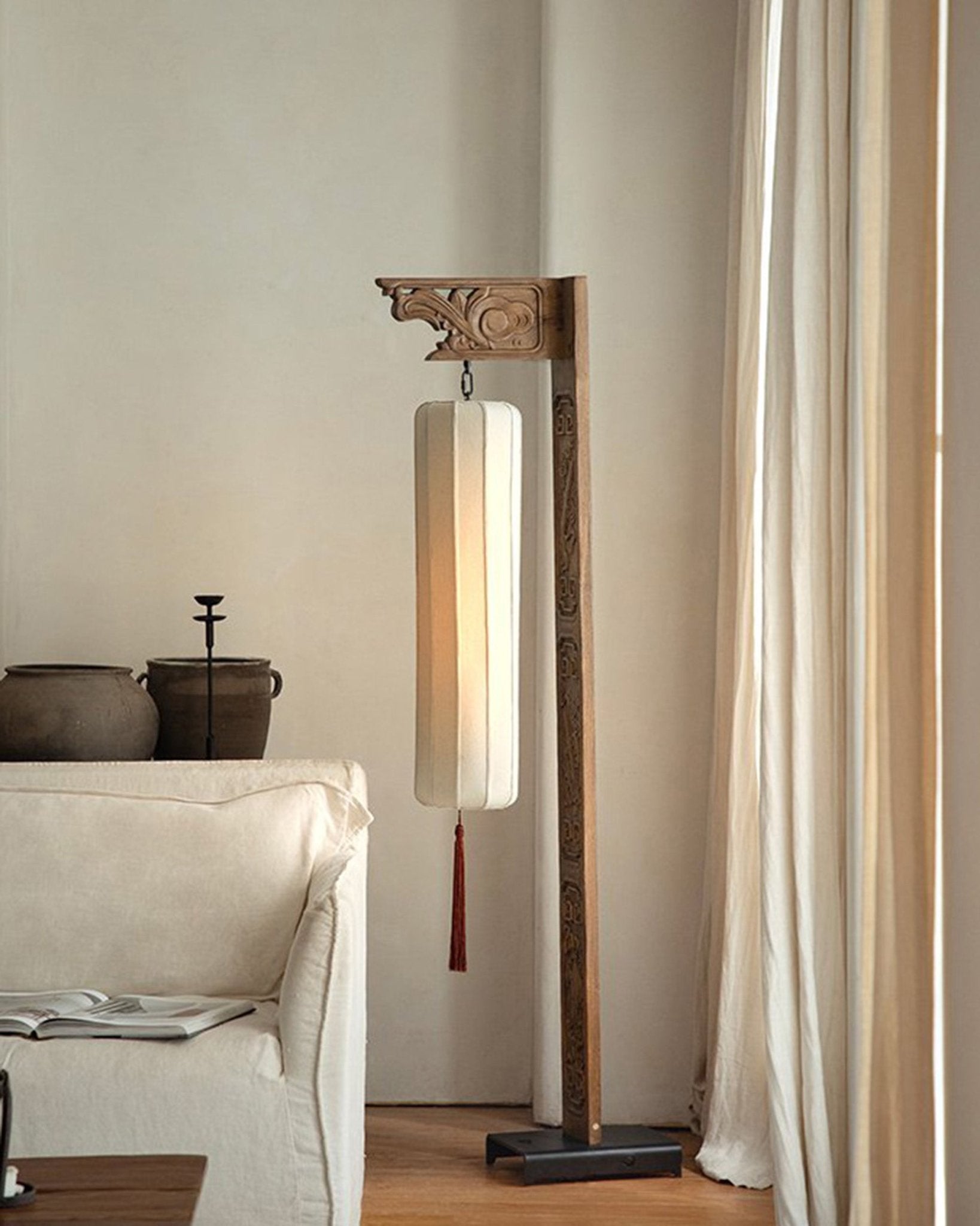 Chinese floor lamp with carved wooden frame and fabric lampshade. Oriental home decor.