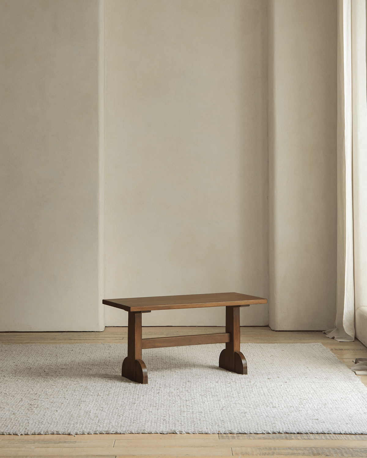 Hoof Side Table in a warm, retro color, made of nanmu wood, with a unique horseshoe design and polished corners.